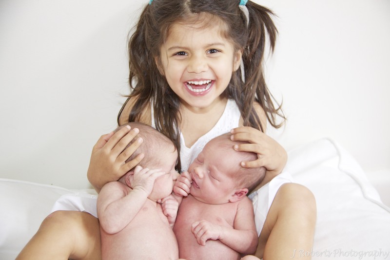 big sister excited about newborn baby twins - newborn portrait photography sydney